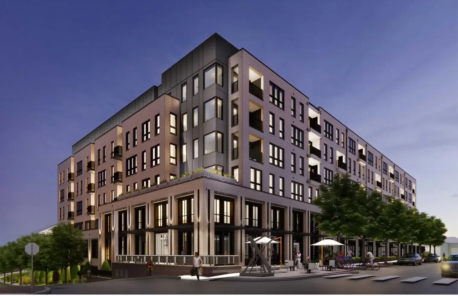 Street-level view of Vivienne apartments in downtown Clayton, MO, showcasing the refined facade and its proximity to local dining.