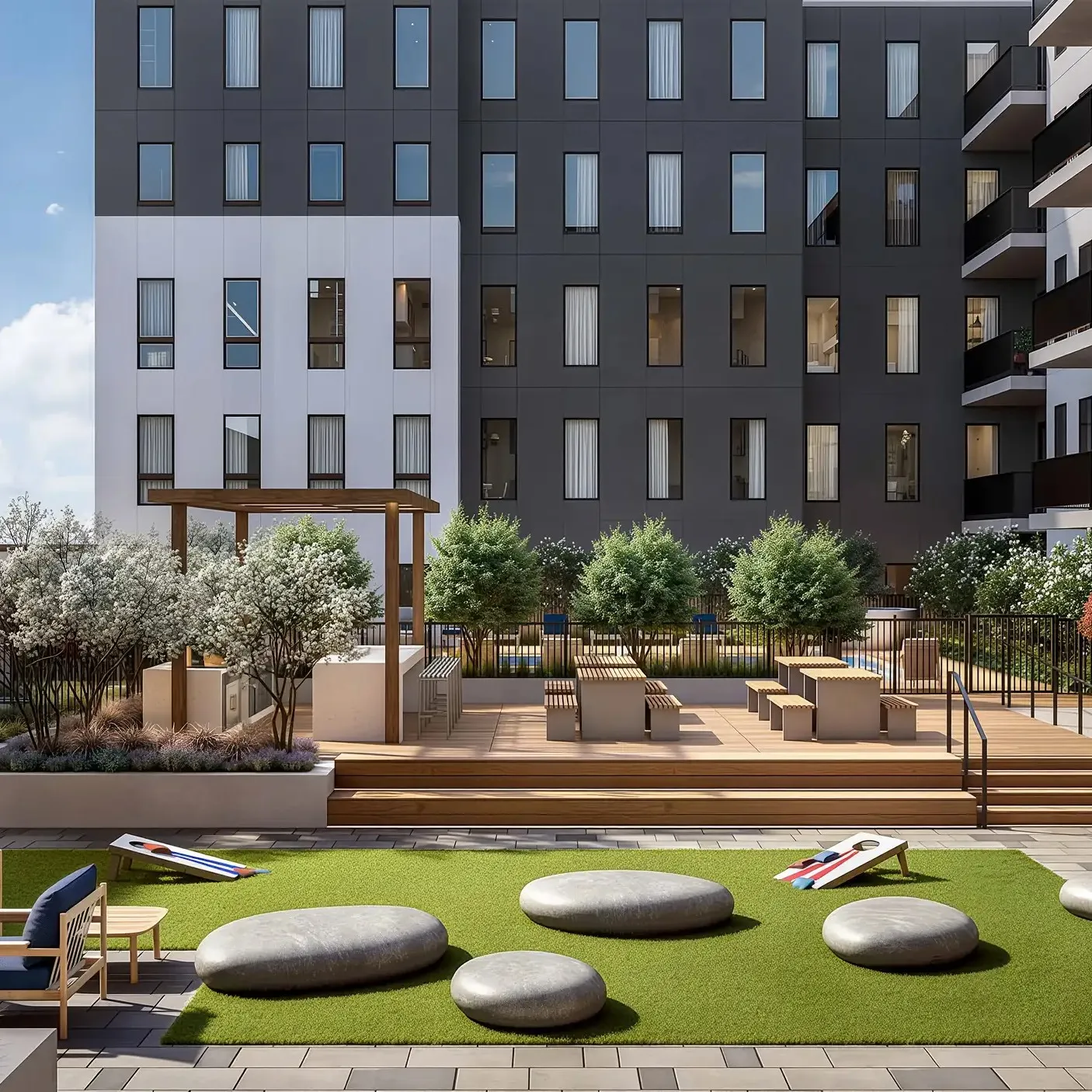 An elegant outdoor lounge at Vivienne featuring designer seating, a warm fire pit, and a calming atmosphere for evening relaxation.